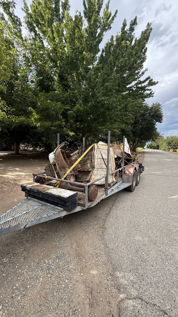 Flatbed loaded with a full property cleanout haul in Ridgecrest — Bryan's